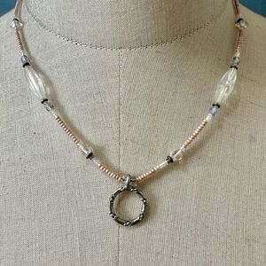 Pink beaded silver tone circle pendant necklace